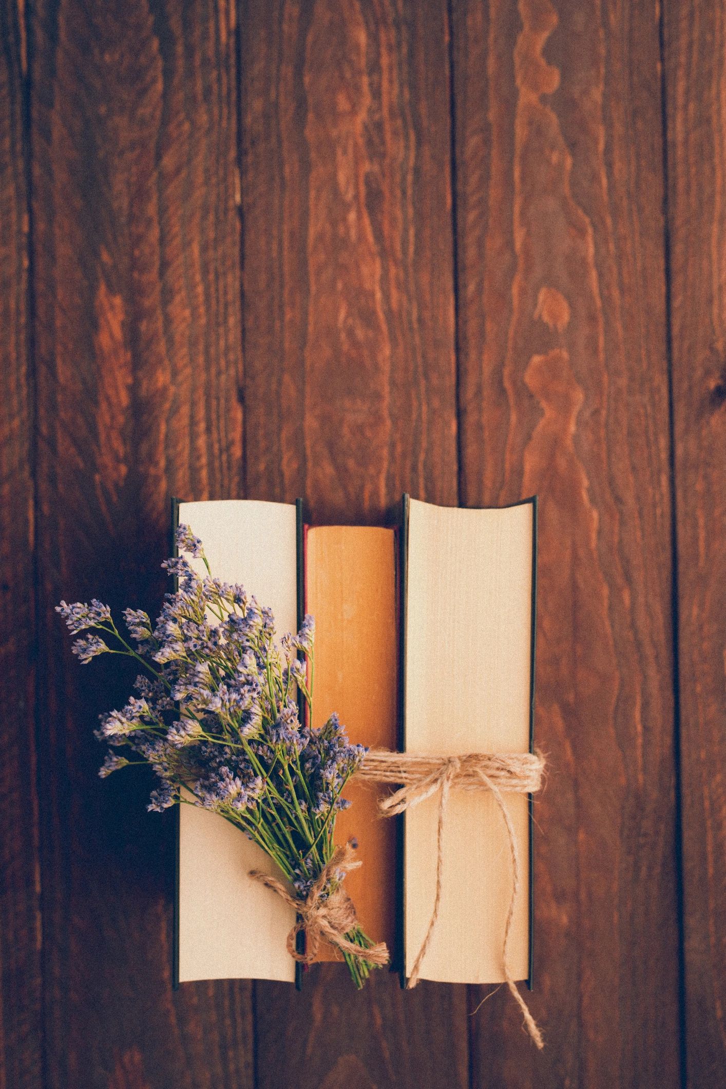 Vintage books arranged with flowers
